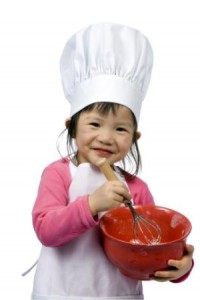 Child holding a mixing boil - cupcake baking