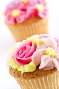 Gourmet cupcakes decorated with pink roses baked with cupcake recipes